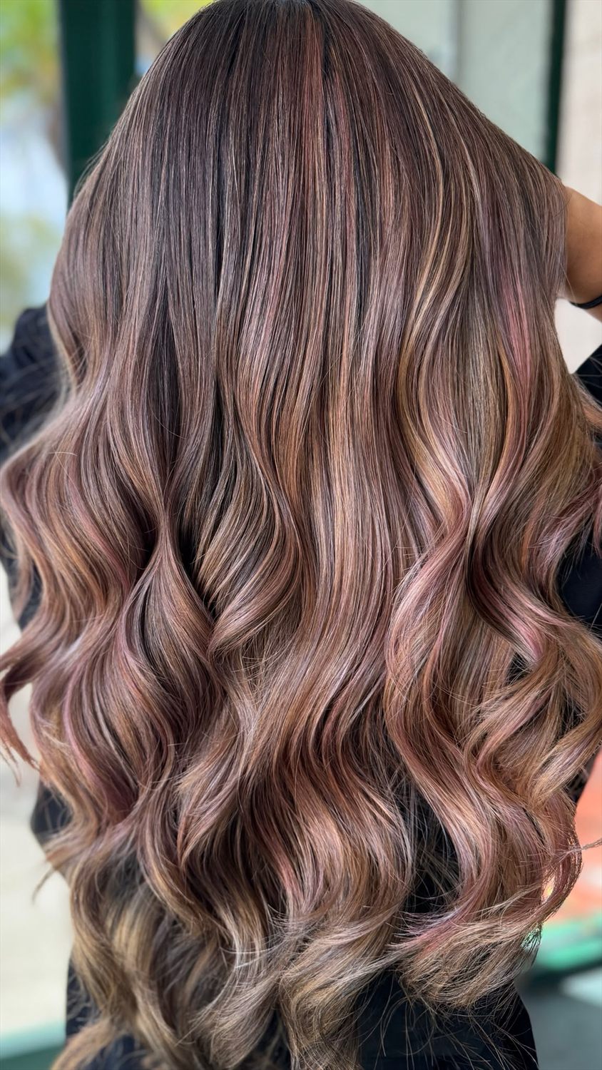 Rose-mauve and copper balayage over a dark brunette base